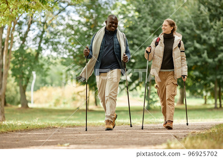 Couple Hiking with Poles Couple Hiking with Poles 96925702