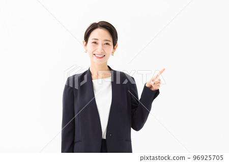 Photo material of an office lady doing a pointing pose 96925705