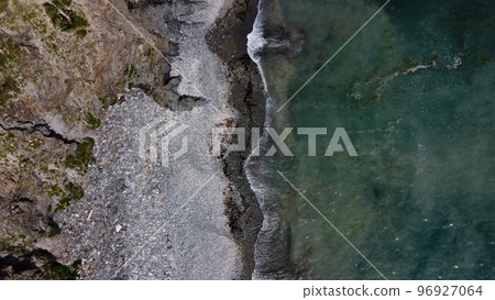 Beautiful rocky beach on the south coast of Ireland near Clonakilty. The picturesque coast of the Celtic Sea. Sea surf. Turquoise waters of the Atlantic. Drone photo. 96927064