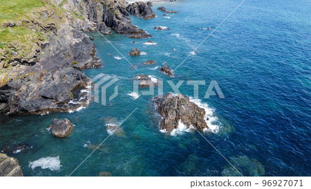 Beautiful rocky shore. Turquoise sea water. Seaside landscape. Nature of Ireland. Landscapes of West Cork. Aerial photo. 96927071