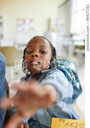 Child reaching to camera 96927262