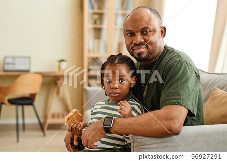 Cozy portrait of black father and daughter Cozy portrait of black father and daughter 96927291