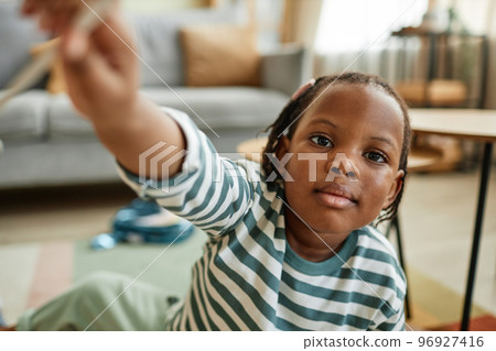 Cute black baby reaching for camera 96927416