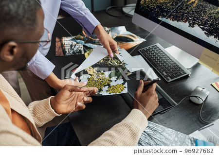 Photographer and Retoucher Choosing Photos 96927682