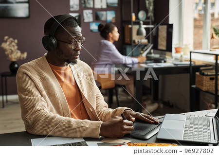 Graphic Designer Working in Office 96927802