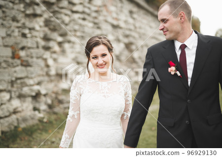 Sensual married couple, valentines hugging in front of old slavic castle 96929130