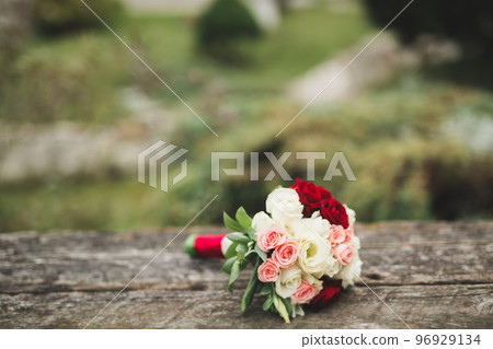 Beautiful wedding bouquet with different flowers, roses 96929134