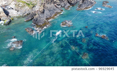 Steep cliffs on the coast of Ireland. Turquoise waters of the Atlantic Ocean. Natural beauties of Ireland, West Cork. The rocky coast of the Celtic Sea. 96929645