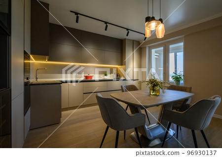 Large modern grey luxurious kitchen and dining room in studio apartment Large modern grey luxurious kitchen and dining room in studio apartment 96930137