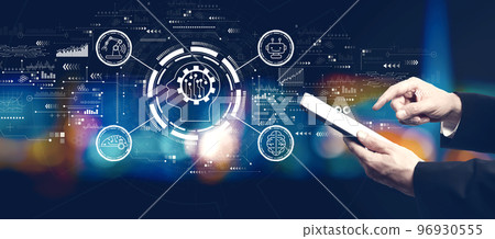 Future technology concept with businessman using a tablet computer Future technology concept with businessman using a tablet computer 96930555