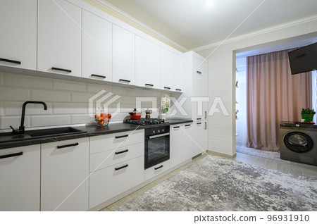 Trendy white modern kitchen interior with minimalistic furniture 96931910