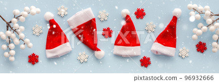 Santa Claus hats and snowflakes 96932666