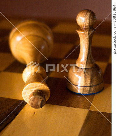 Pawn wins a victory over the king. Chess pieces. Pawn wins a victory over the king. Chess pieces. 96933964
