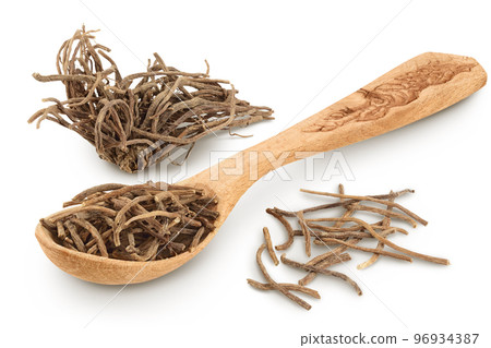 Dried Valerian root in wooden spoon isolated on white background. Valeriana officinalis with full depth of field. Dried Valerian root in wooden spoon isolated on white background. Valeriana officinalis with full depth of field. 96934387