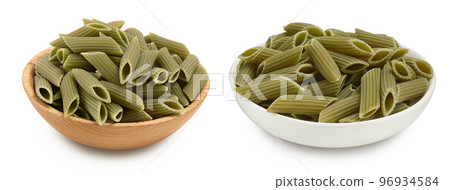 Green pea penne pasta in wooden bowl isolated on white background . Organic food speciality. Gluten free. Top view. Flat lay Green pea penne pasta in wooden bowl isolated on white background . Organic food speciality. Gluten free. Top view. Flat lay 96934584