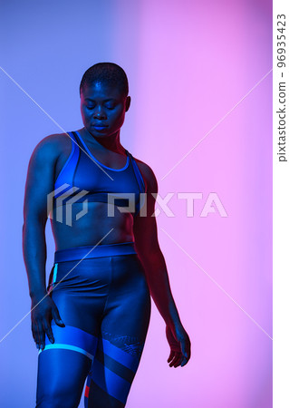 Body Positivity And Sport. Smiling Curvy Black Woman In Sportswear Free Copy Space For Advertisement, Standing Isolated On Neon Pink Studio Background, Banner Body Positivity And Sport. Smiling Curvy Black Woman In Sportswear Free Copy Space For Advertisement, Standing Isolated On Neon Pink Studio Background, Banner 96935423