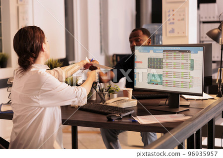Woman analyzing company investment revenue on fund market website in coworking space, bokerage agent looking at stock exchange statistics on computer screen. Financial analytics monitoring 96935957