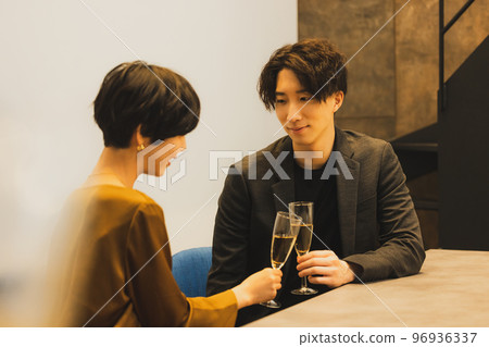 A couple toasting with champagne A couple toasting with champagne 96936337