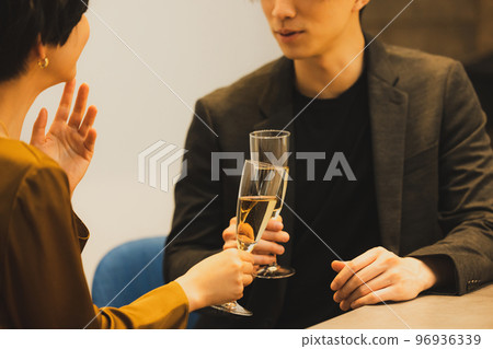 A couple toasting with champagne A couple toasting with champagne 96936339