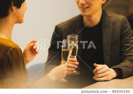 A couple toasting with champagne A couple toasting with champagne 96936340