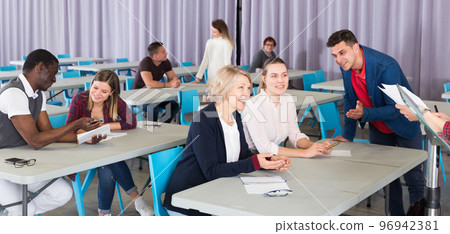 Adult students discussing lesson Adult students discussing lesson 96942381