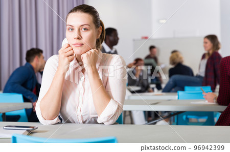 Frustrated woman student in classroom 96942399