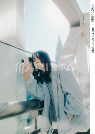 Photo with a high school girl and a smartphone in the city Photo with a high school girl and a smartphone in the city 96943260
