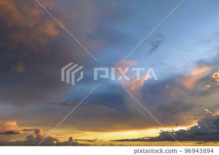 White fluffy cumulonimbus clouds forming before thunderstorm on evening sky. Changing stormy cloudscape weather at sunset 96943894