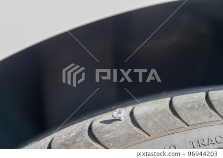Tire puncture with a screw Tire puncture with a screw 96944203