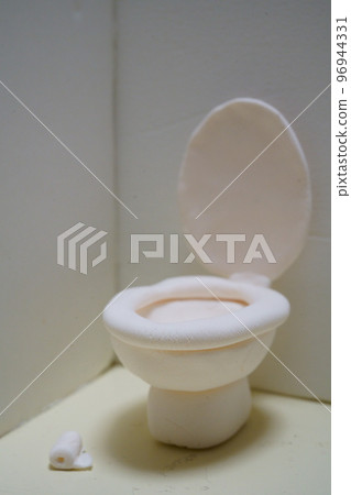 A style toilet with an open lid Western-style toilet made of clay 96944331