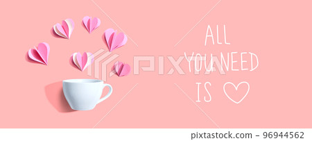 All you need is love message with a coffee cup and paper hearts 96944562