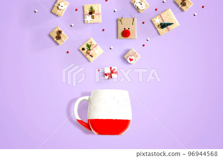 Christmas gift boxes with a red mug 96944568