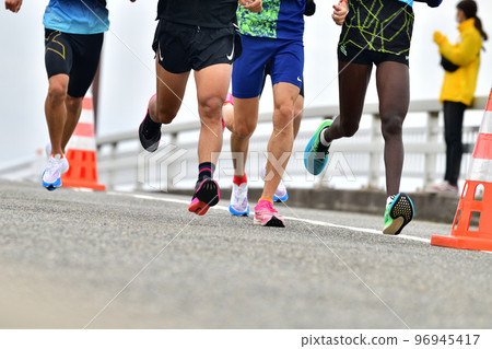 Marathon Marathon runner running downhill Marathon Marathon runner running downhill 96945417