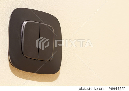 New gray electrical power outlet socket, plastic switch isolated installed on light yellow plastered wall. Home interior, electricity supply concept New gray electrical power outlet socket, plastic switch isolated installed on light yellow plastered wall. Home interior, electricity supply concept 96945551