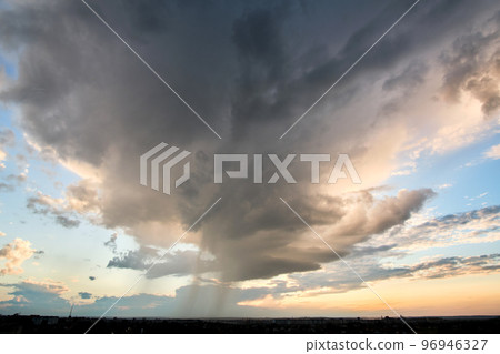 Landscape of dark clouds forming on stormy sky during thunderstorm. Landscape of dark clouds forming on stormy sky during thunderstorm. 96946327