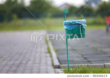 Garbage bin outdoor on blurred sunny background. 96946614