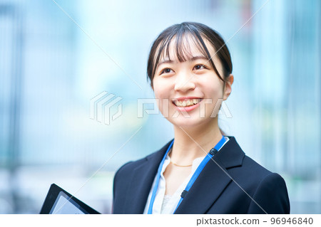 A young lady in a suit 96946840