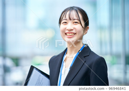 A young lady in a suit 96946841