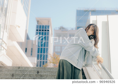 A picture of a high school girl meeting in the city A picture of a high school girl meeting in the city 96946926
