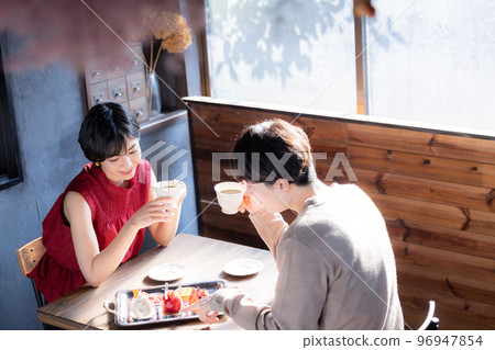 A couple doing dates at a cafe A couple doing dates at a cafe 96947854