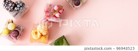 Frozen ice cubes with various berries 96948523