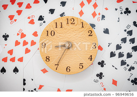Playing cards and clock 8:35 96949656