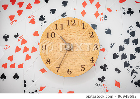 Playing cards and clock 10:35 96949682
