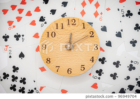 Playing cards and clock 12:10 96949704