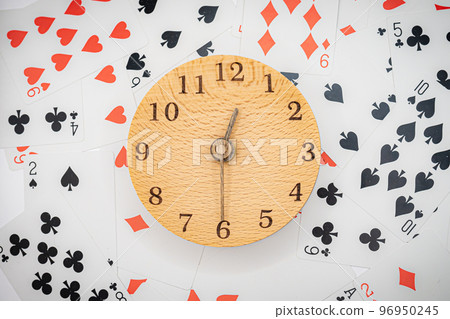 Playing cards and clock 12:30 96950245