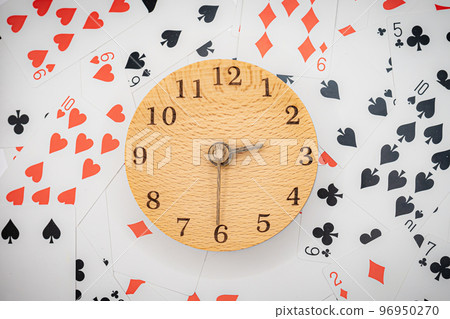 Playing cards and clock 14:30 96950270