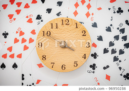 Playing cards and clock 3:50 96950286