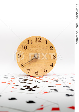 Playing cards and clock 7:40 96950483
