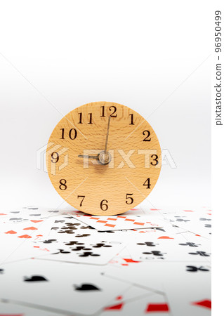 Playing cards and clock 9:00 96950499