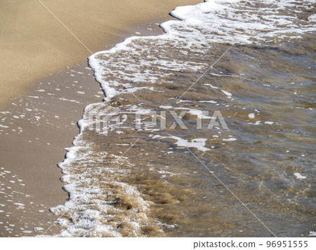 Waves on the sandy beach. Waves on the sandy beach. 96951555